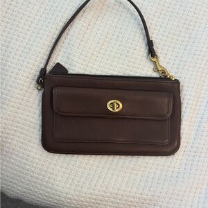 1 brown coach wristlet